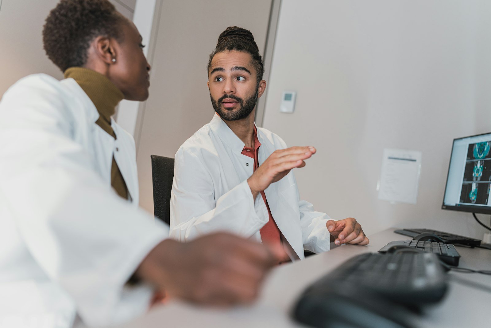 Two clinicians reviewing patient scan results together