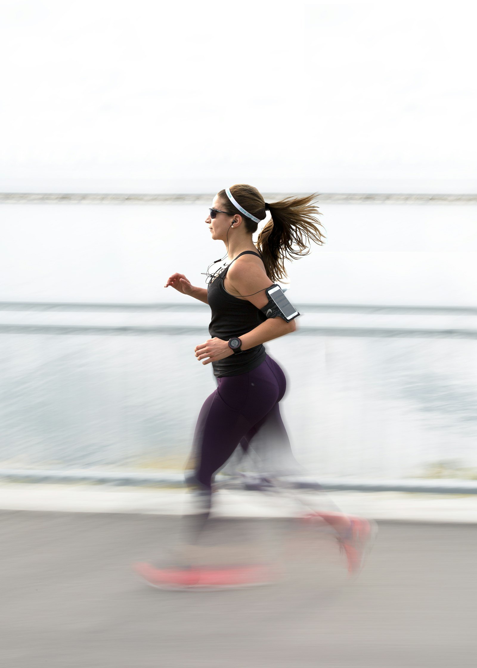 A person out running while tracking their health data on a wearable device